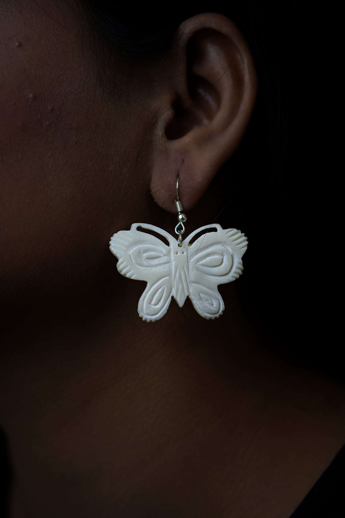 Tribal Treasures: Hand-Carved Bone Jewelry Butterfly Earrings