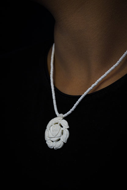 Whimsical Whorls: Handcarved Bone Pendant