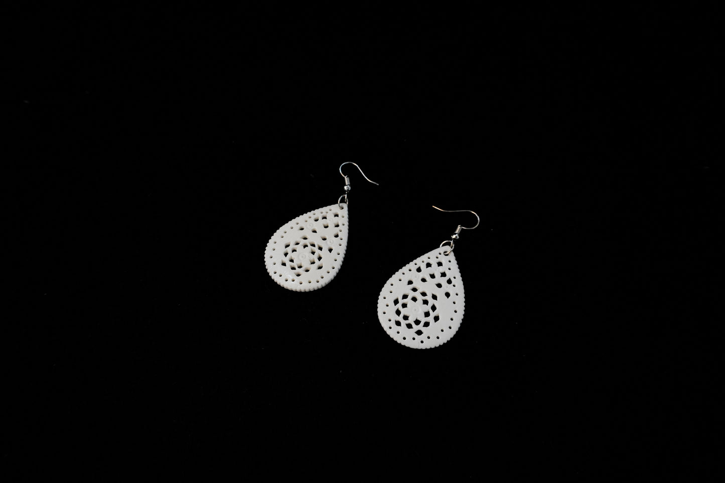 Harmony in Form: Handcrafted Bone Carving Dangle Earrings